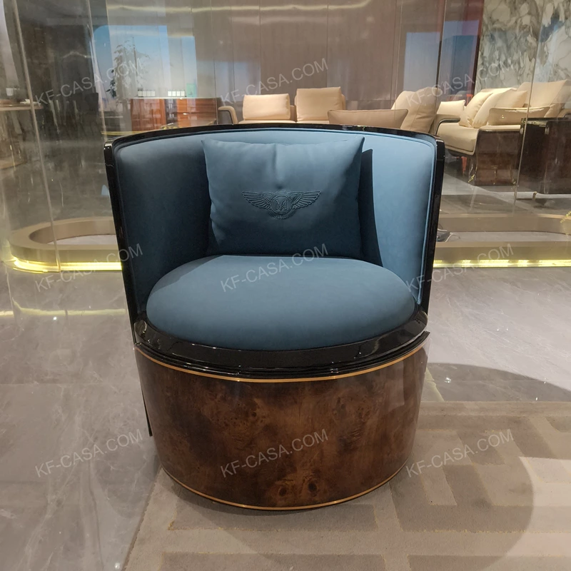 Glossy Burl Wood Tub Chair with Blue Fabric Upholstery and Metal Trims